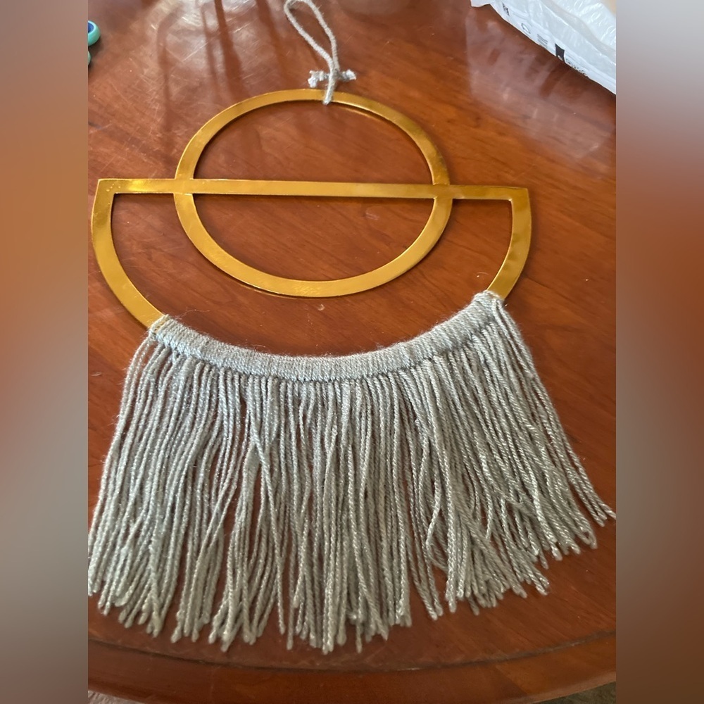 4/$25 Boho Gold finish semi circle metal ring & grey yarn fringe. In EUC.